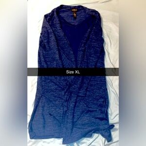 Two piece set, camisole is attached to sweater.